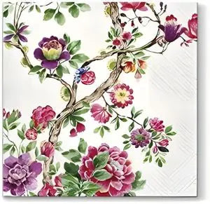 Floral design on a white napkin with purple, pink, and green flowers.